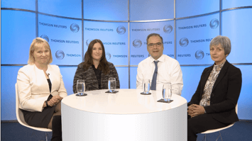 4 people around a table in studio