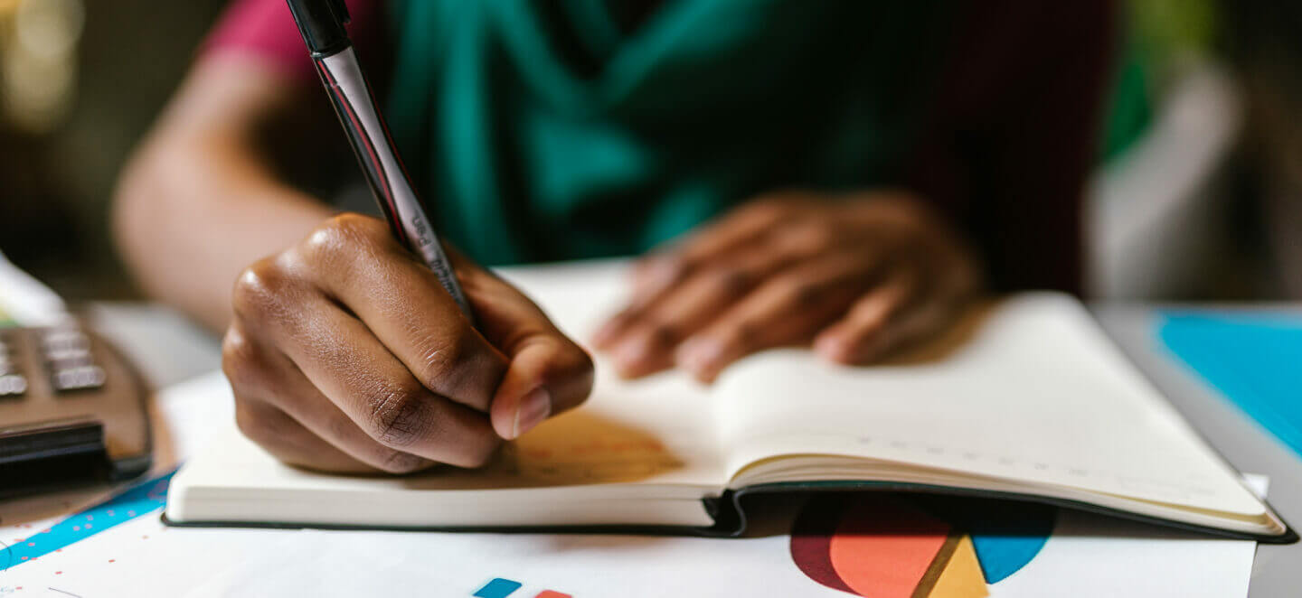 Woman writing in notebook